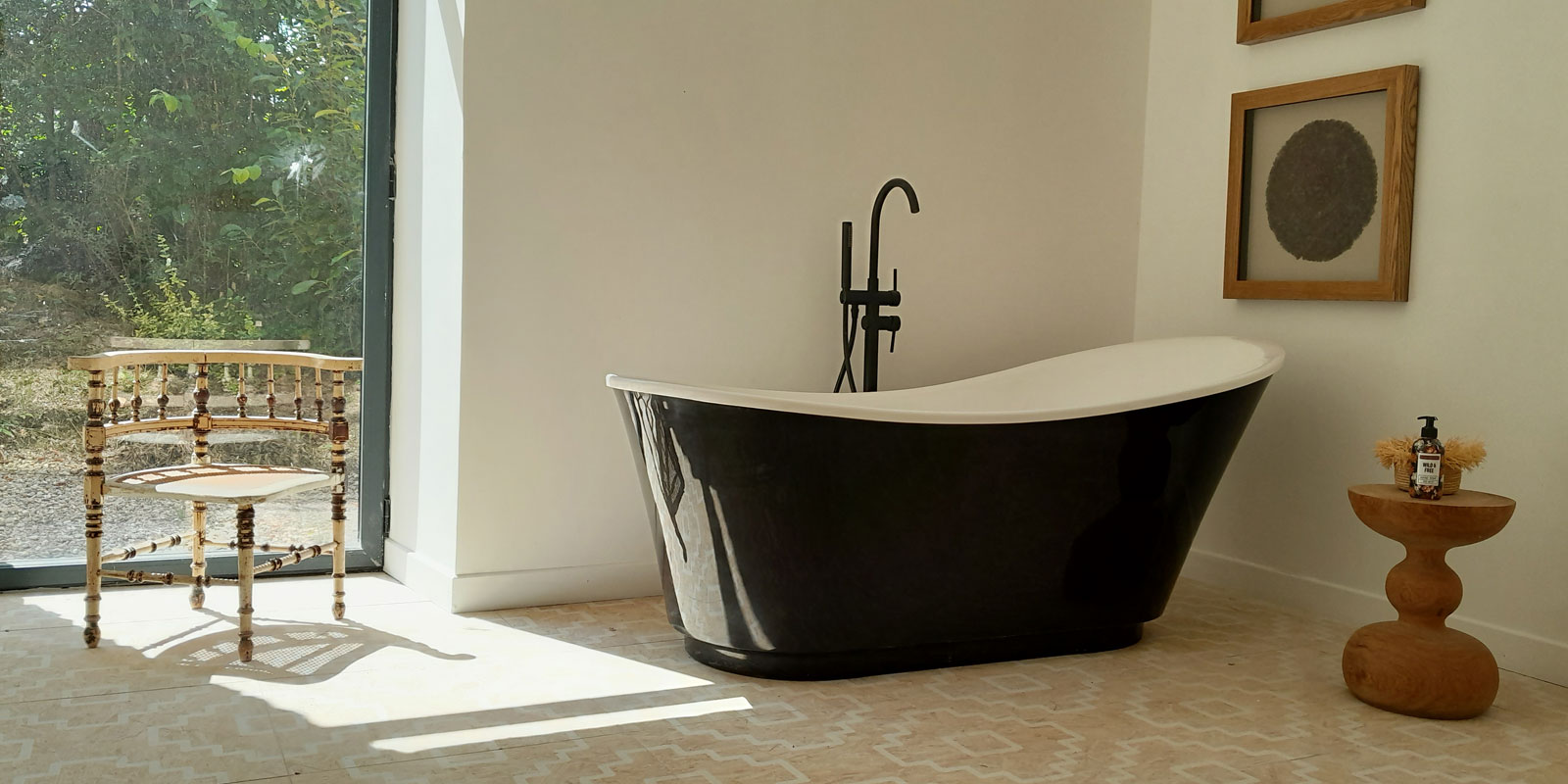 free-standing bathtub in black with white interior