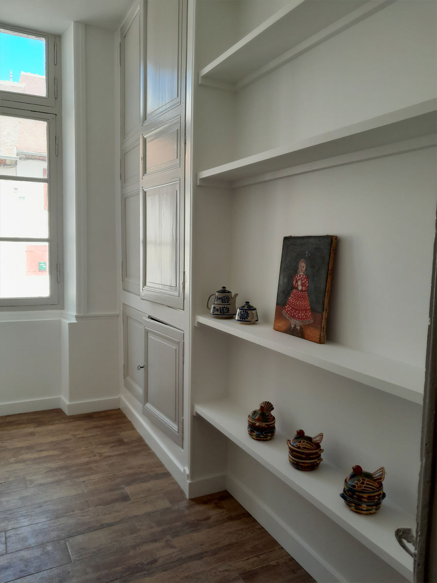 the laundry room after the work, with custom-made storage units